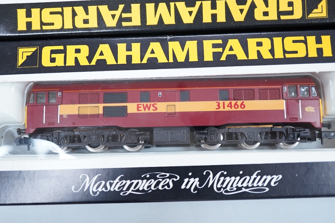 Four boxed Graham Farish N gauge railway diesel locomotives; a BR class 31, D5558 (8064), a Regional Railways class 31, Wigan Pier 31421 (8067), an EWS class 31, 31466, (806B) and a BR class 25, D7645 (8304).